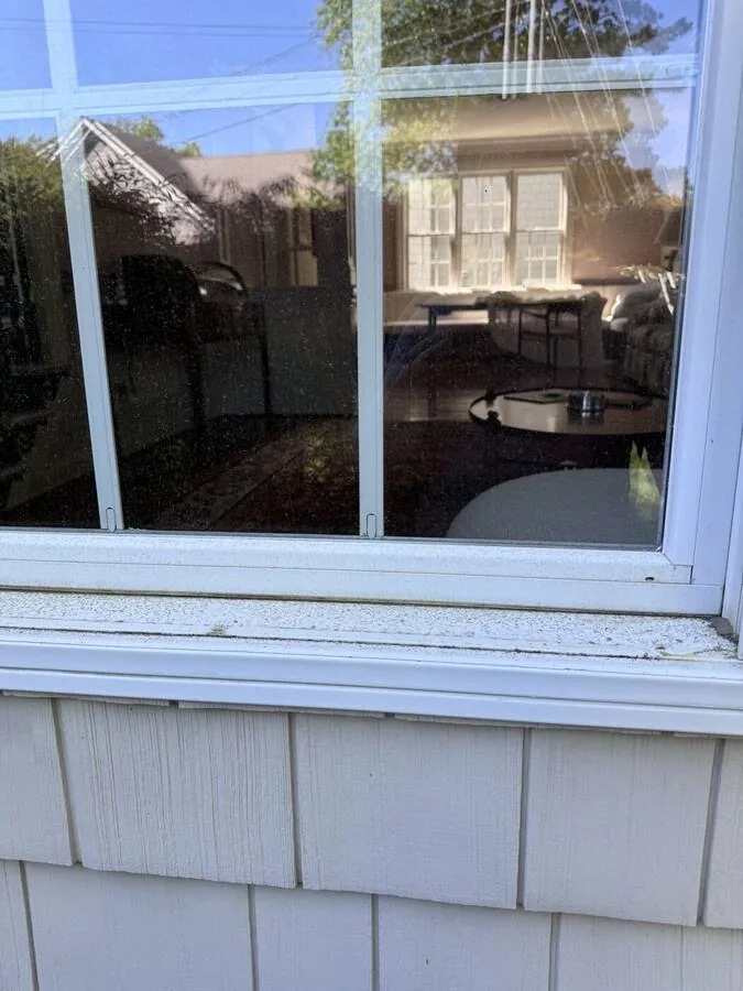 Window and sill before cleaning
