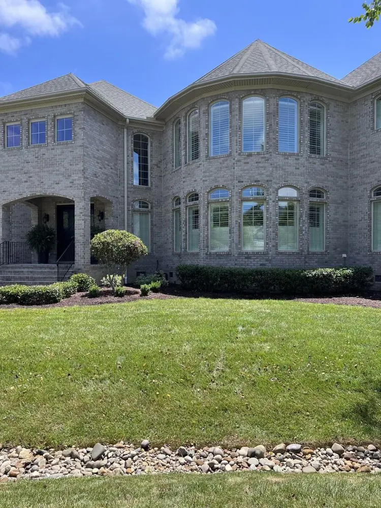Two-story home with freshly cleaned exterior windows